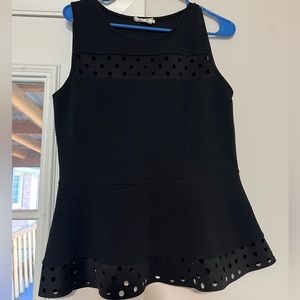 Black peplum tank with cutout dots